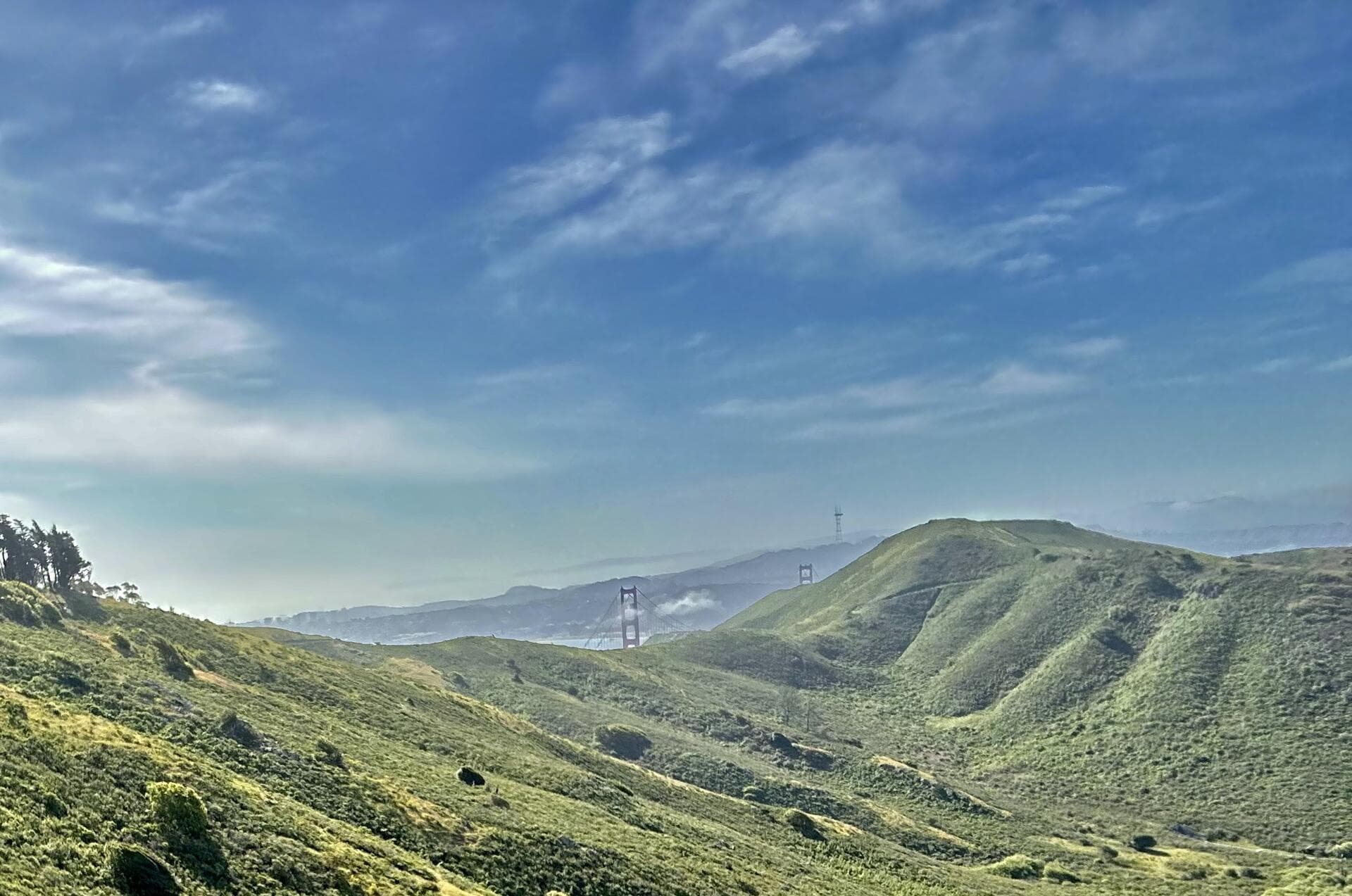 A scenic view of the Golden Gate Bridge shrouded in morning mist